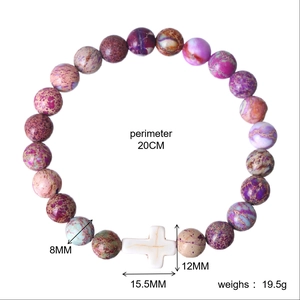 Beaded bracelet detailing dimensions including 8MM beads and 15.5MM white cross charm