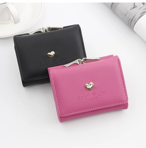 Detail of PU leather wallets with heart metal clasp and Sweet Dream text embossing