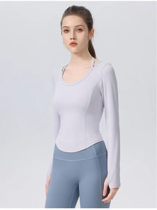 Detail of lavender slim fit long sleeve yoga top with curved hem and crew neckline