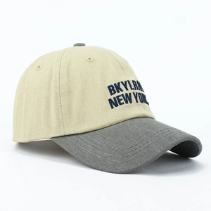 Close-up of cotton baseball cap with BKYLRN NEW YORK embroidery and contrast brim