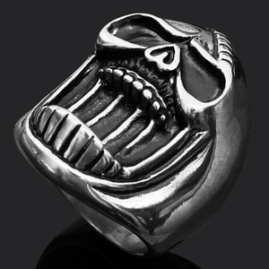 Macro shot of retro silver skull ring for men with punk gothic design and metal reflection