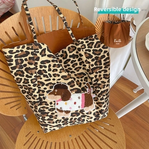 Detail of leopard print canvas tote bag featuring a 3D dachshund plush embroidery patch