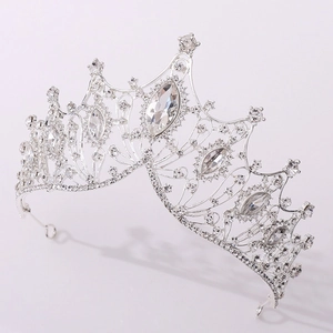 Macro detail of silver bridal crown showing intricate rhinestone patterns and craftsmanship