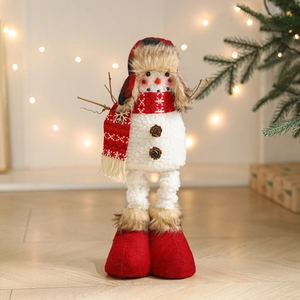 Standing Christmas snowman doll with red plaid hat and scarf in warm festive lighting
