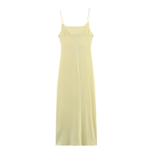 Detail of light yellow maxi dress showing minimalist thin straps and back ruching design