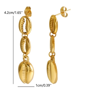 Detailed view of gold conch shell drop earrings with 4.2cm length and professional finish