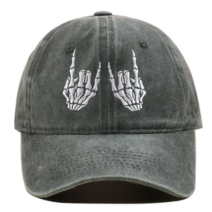 Macro shot of white skeleton hands embroidery on a washed cotton vintage baseball cap