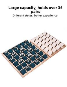 Detail of 36-slot wooden earring display tray with premium green and beige velvet lining