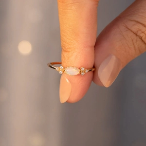 Macro shot of s925 silver ring featuring marquise opal and sparkling zircons