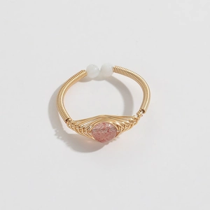 Detail of 14K gold plated wire wrapped ring with natural pink stone and adjustable open band