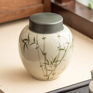 Ceramic tea canister with green bamboo pattern and elegant grey lid for loose leaf storage