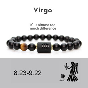 Macro shot of Virgo beaded bracelet with matte black onyx stones and a tiger eye bead