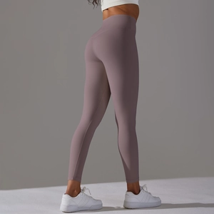 Detail view of high waisted mauve yoga leggings showing butt lifting effect and smooth fabric