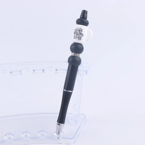 DIY beaded pen with white coffee cup topper and Wife Mom Boss text on black plastic