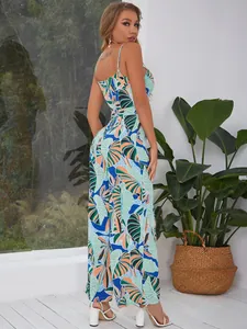 Detail of tropical palm leaf print jumpsuit with open back and wide leg design
