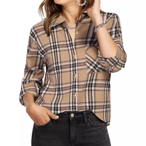Detail of classic plaid shirt collar and button-down front in brown and black tones