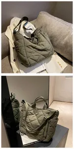 Detail of army green quilted tote bag showing nylon texture and adjustable strap