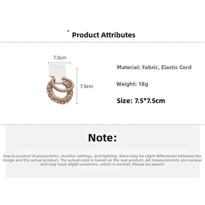 Détail de chouchous en soie champagne montrant la texture satinée et la taille 7,5cm