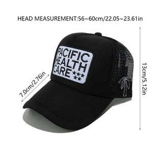 Detail of black trucker hat showing palm tree embroidery and mesh back structure