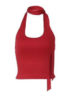 Detail view of red halter neck sleeveless top with high-stretch fabric on white background