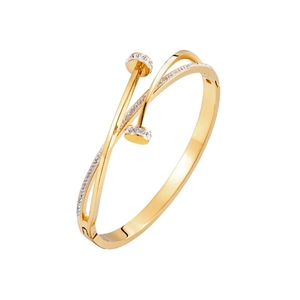 Macro detail of gold-plated titanium steel nail bracelet with sparkling zircon accents