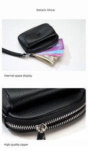 Detail of litchi pattern leather coin purse with silver zipper and wrist strap