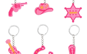 Detailed set of pink PVC cowboy keychains featuring a guitar, sheriff star, and denim hat