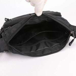 Black multi-pocket crossbody bag with spacious interior compartments for daily commuting