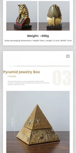 Detailed view of golden Egyptian pharaoh statue and decorative pyramid jewelry box