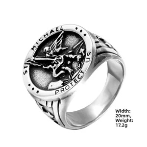 Macro shot of St. Michael engraving on 20mm vintage stainless steel ring with dragon claws