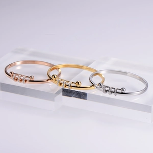Titanium steel open bangles with crystal sliding rings in gold, silver, and rose gold