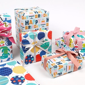 Colorful cartoon happy birthday gift wrapping paper set with ribbons on white background
