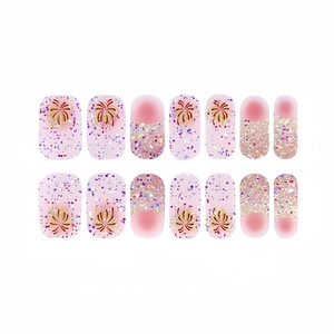 Adesivi per unghie sfumati rosa con glitter e motivo a fuochi d'artificio dorati