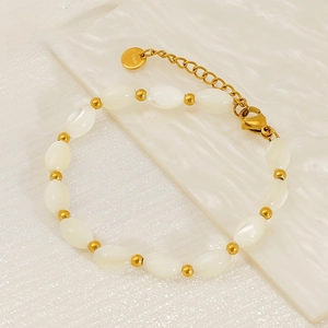Close-up of stainless steel beaded bracelet with pearls and S.Steel logo tag