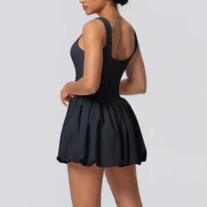 Back view of black tennis dress featuring a stylish bubble hem and sporty racerback design
