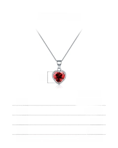Detail of s925 sterling silver necklace with heart-shaped red zircon and diamond halo