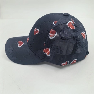 Distressed dark blue baseball cap with heart pattern and vintage worn-out details