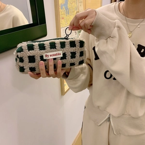 Green and white checkered waffle fleece large capacity pencil case held by hand