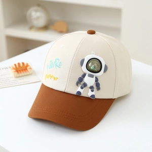 Detail of color-blocked boy cap with 3D astronaut and embroidered Future Partner text