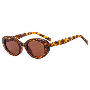 Retro tortoise shell oval sunglasses with dark brown lenses shown at a 45-degree angle