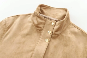 Close-up of brown suede jacket stand-up collar and three metallic gold button details