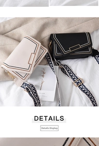 Detail of crossbody bag embroidery and ethnic geometric wide shoulder strap
