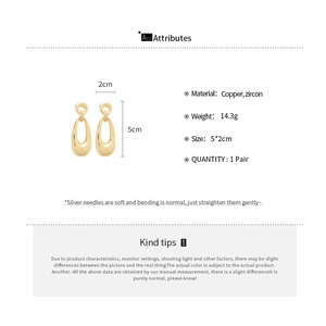 Detailed size specifications for gold oval earrings featuring sparkling cubic zirconia