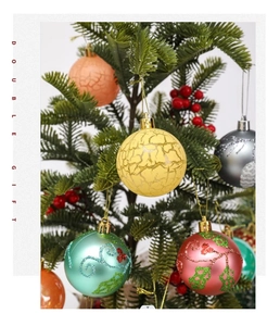 Detail of 6cm Christmas painted balls with glitter floral patterns on tree branches
