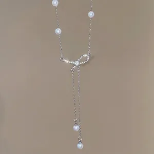 Elegant silver bow pearl pendant necklace with sparkling rhinestones for women