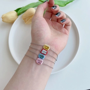 Detail of four S925 sterling silver bracelets with colorful enamel and zircon gemstones