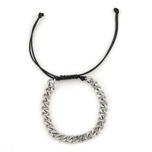 Detail of silver stainless steel curb chain with black braided cord and adjustable closure