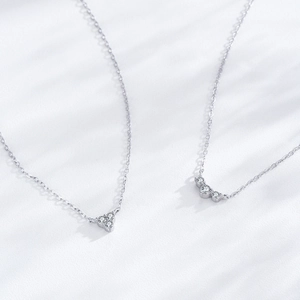 S925 sterling silver geometric triangle necklace with zircon stones on white background