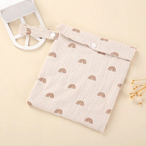 Detail of beige baby organizer bag with rainbow print and snap button closure