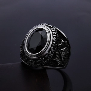Vintage stainless steel Eye of Horus ring with large oval black gemstone and carved details